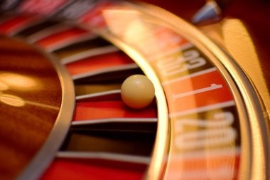 Mobile device showing live roulette table with betting interface and dealer on hatitogel